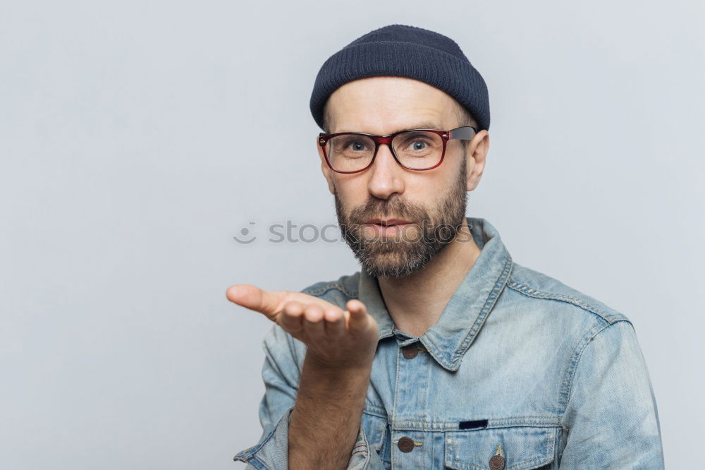 Similar – Portrait of a man with glasses and mustache with crossed arms