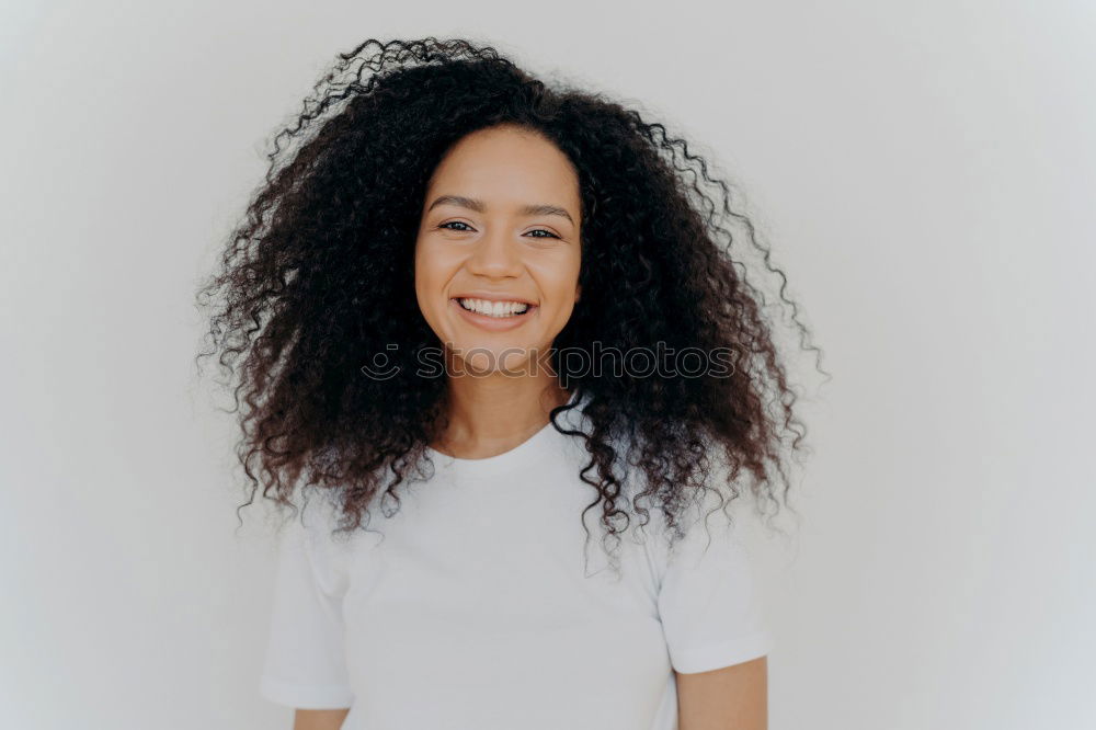 Similar – Young happy woman surrounded by green leaves