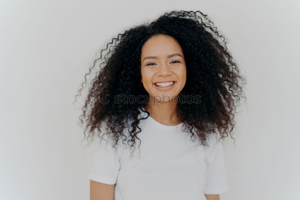 Similar – Image, Stock Photo Young black woman smiling and looking at camera