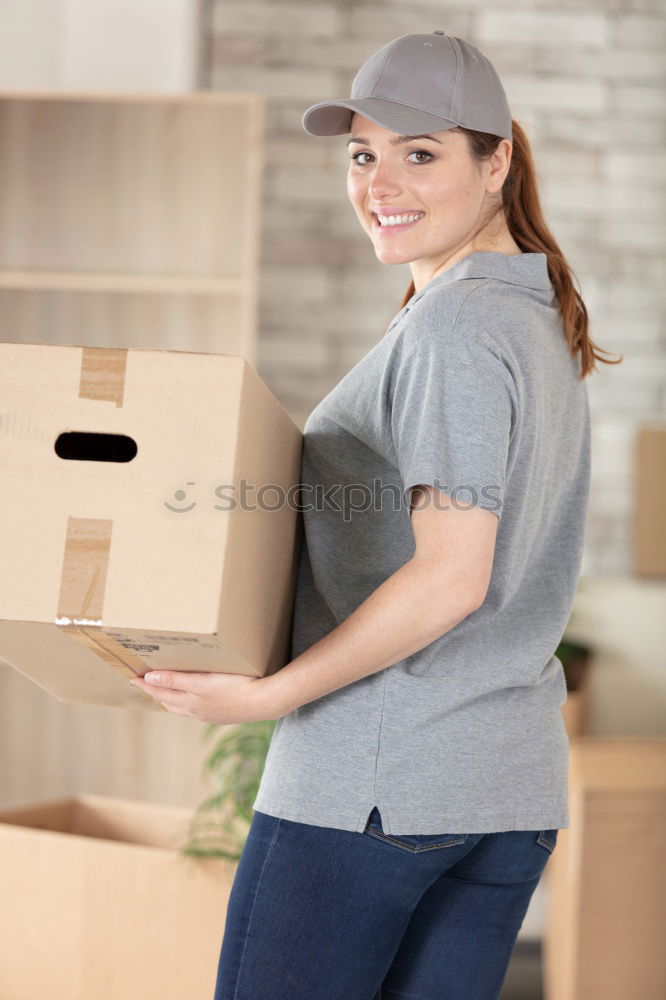 Similar – Man carrying moving boxes