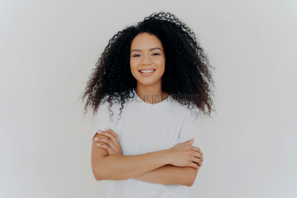 Similar – close up of a pretty black woman with curly hair smiling and lying on bed looking away