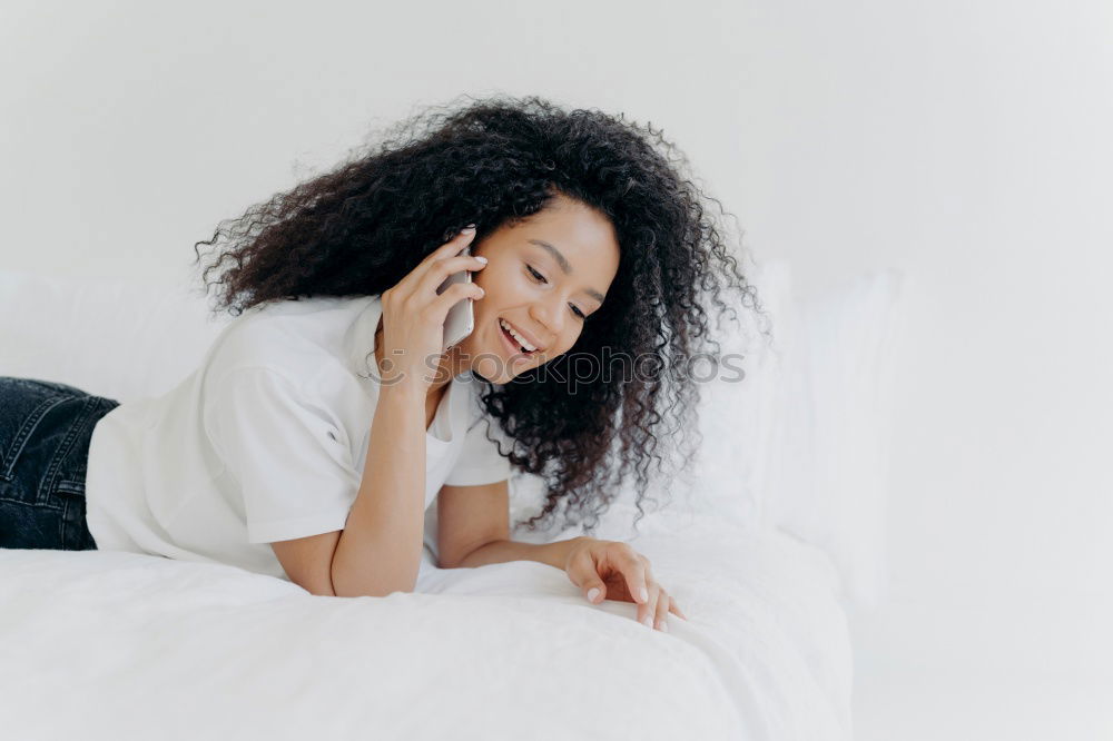 Similar – Image, Stock Photo Happy beautiful young black woman seating in the bed smiling