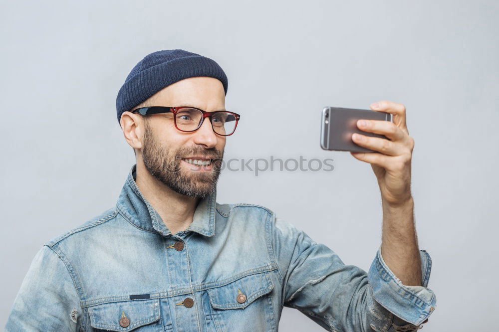 Similar – Image, Stock Photo Portrait of a man with mustache using his smartphone.