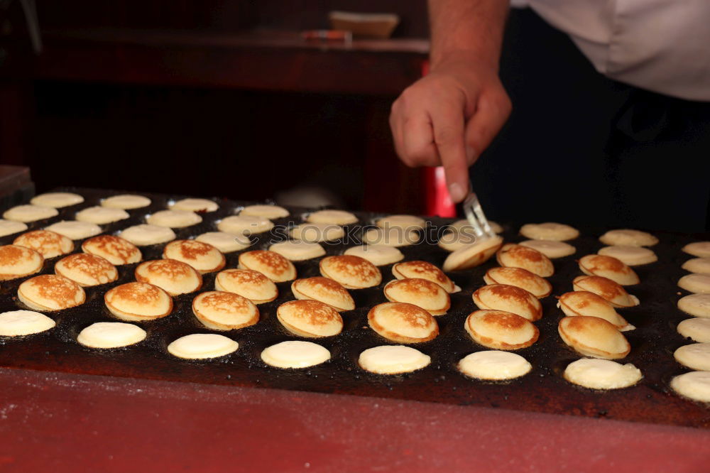 Similar – Baker carrying rack with fresh pastry