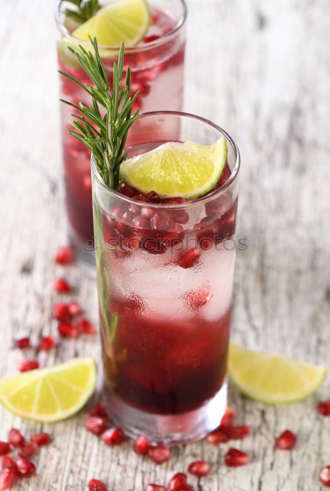 Similar – A glass of cool delicious soft drink with strawberry and currant on white background