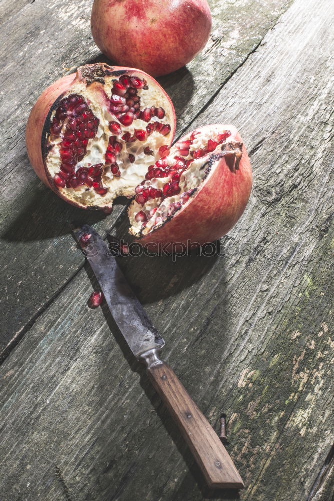 Pomegranate on vintage wooden table