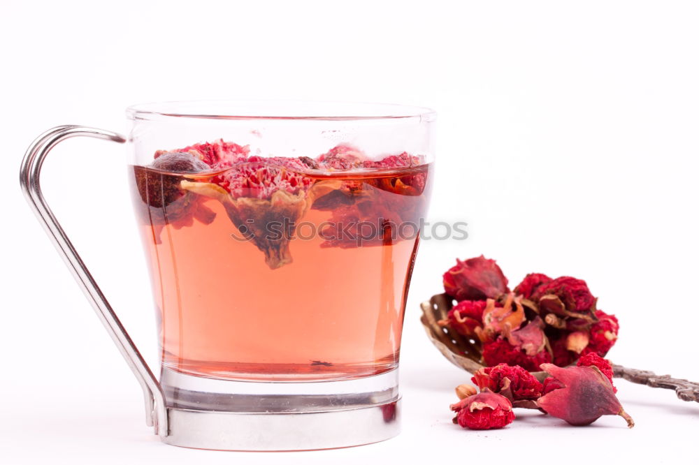 A glass of cool delicious soft drink with strawberry and currant on white background