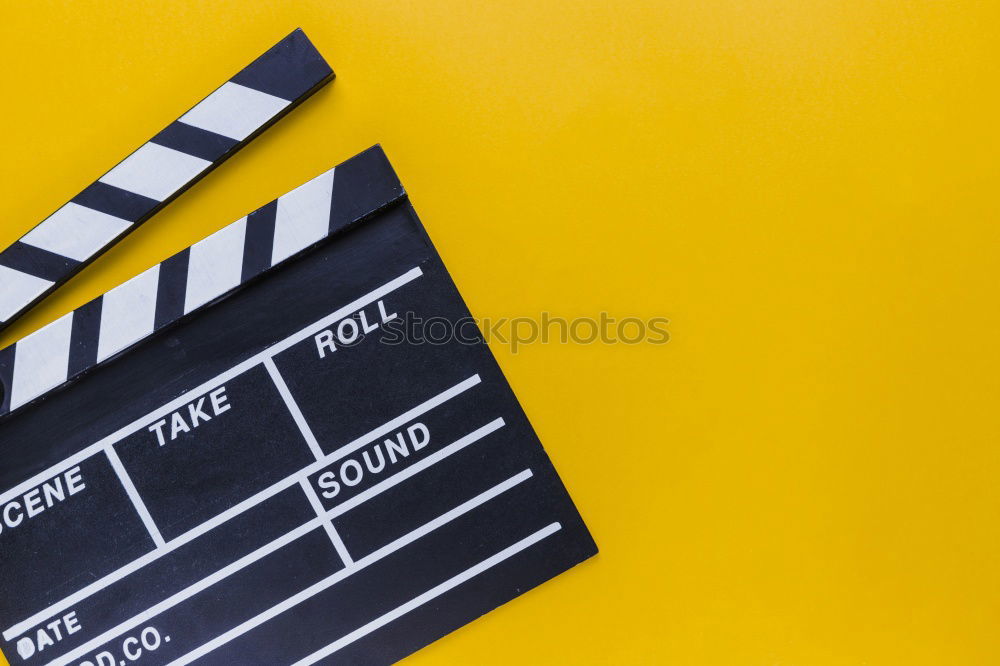 Similar – popcorn and clapboard on yellow background. Cinema concept