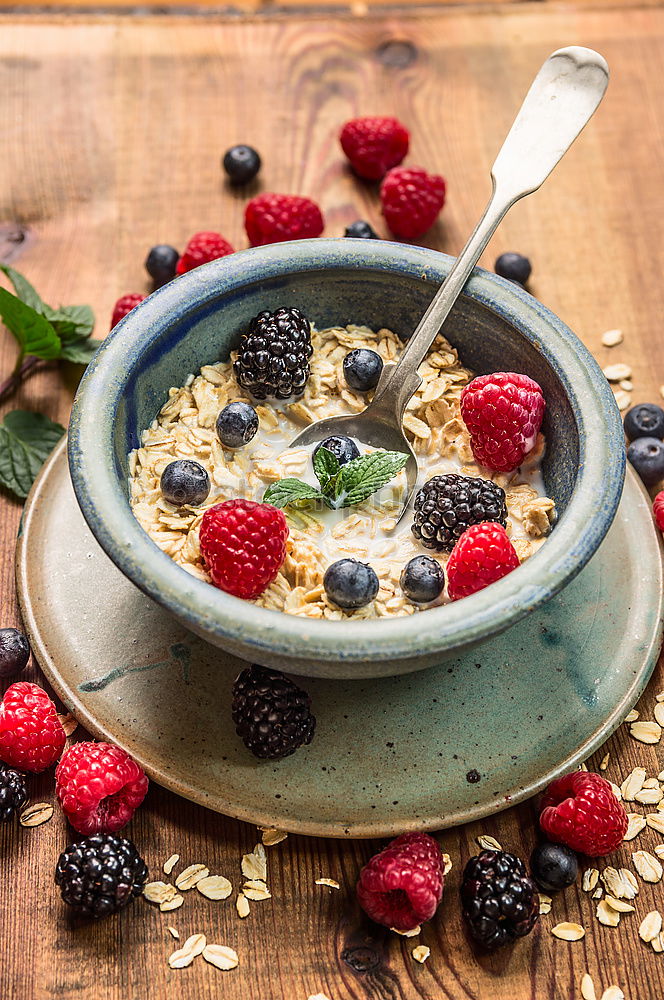 Similar – Oat flakes with milk and berries