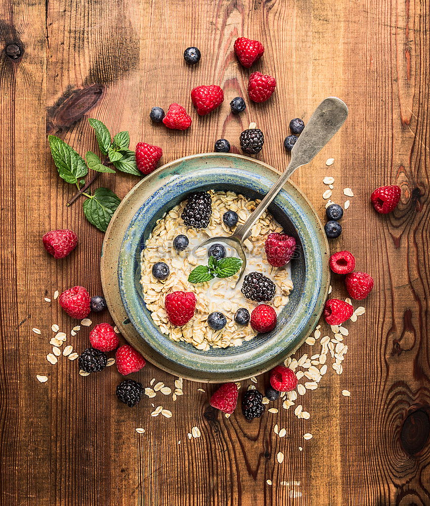 Oat flakes with berries and spoon