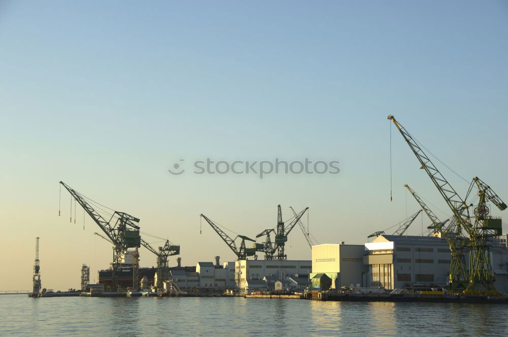 Similar – Pastel evening atmosphere at the harbor basin with cargo cranes