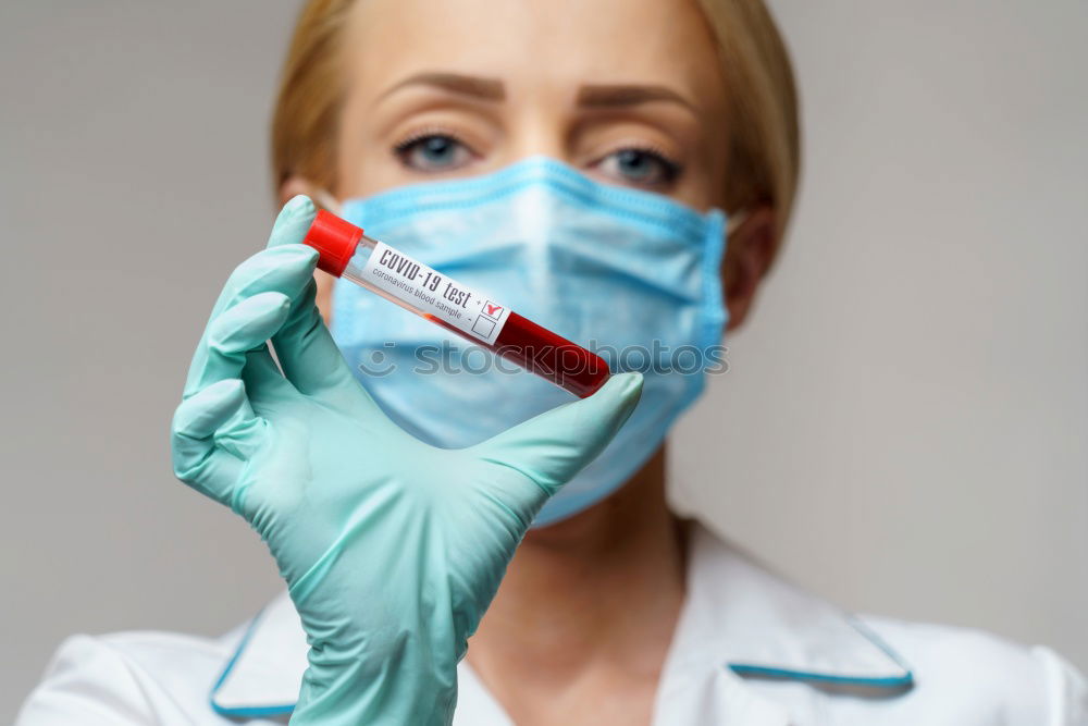 Similar – Image, Stock Photo Female doctor with face mask, protective gloves and lab coat