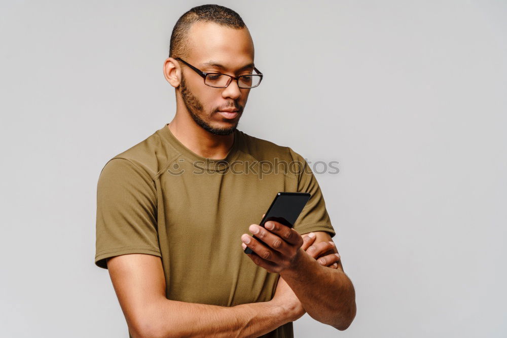 Similar – Image, Stock Photo Young black man using smart phone outdoors