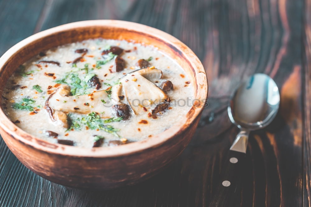 Similar – Pumpkin soup on the plate and salad