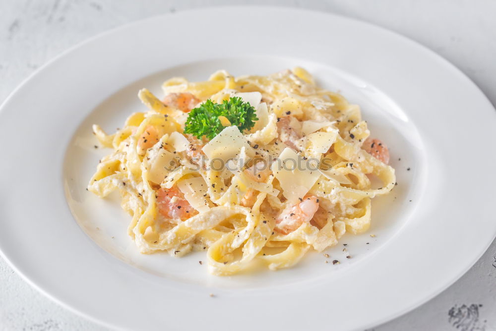 Similar – Spaghetti Carbonara in a green plate