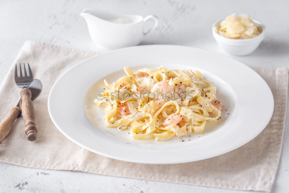 Similar – Spaghetti Carbonara in a green plate