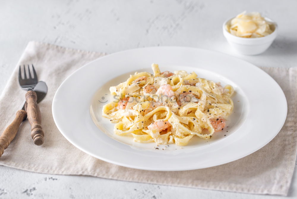 Similar – Spaghetti Carbonara in a green plate