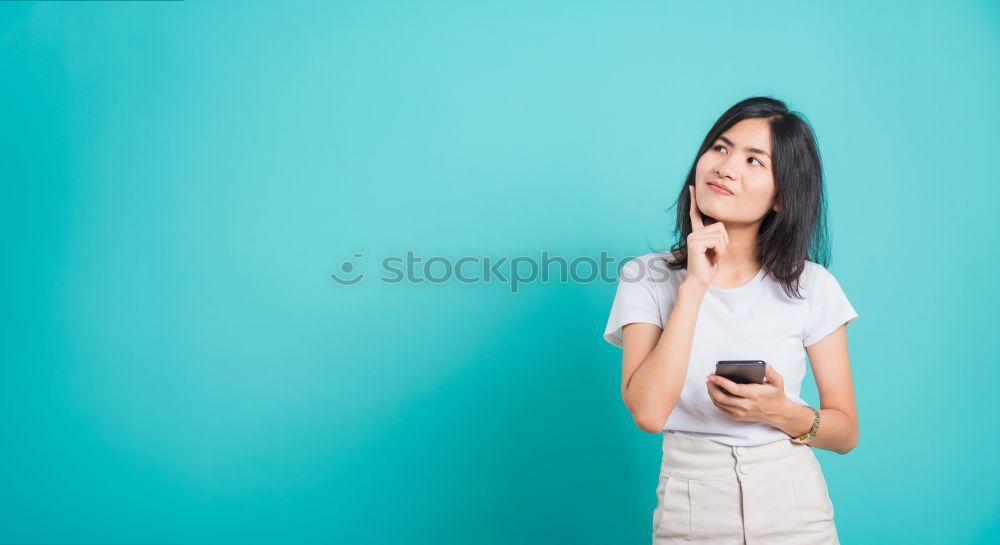 Similar – Image, Stock Photo Young woman in yellow dress using mobile phone