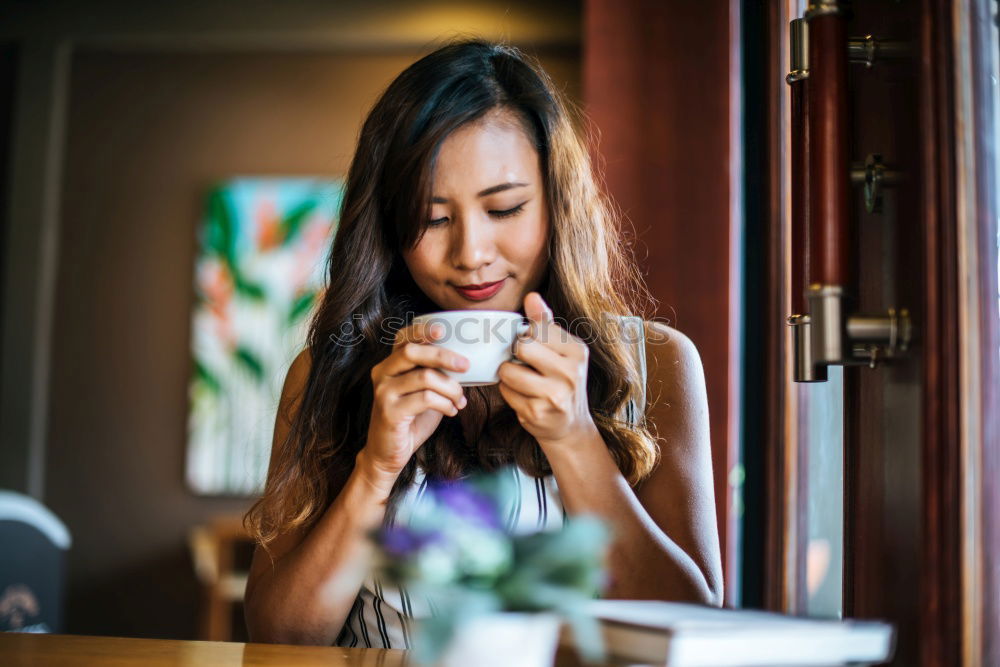 Similar – Ethnic woman stirring cup of coffee