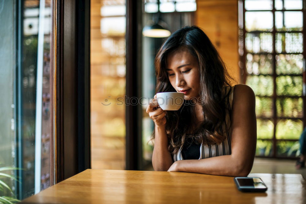 Similar – Ethnic woman stirring cup of coffee