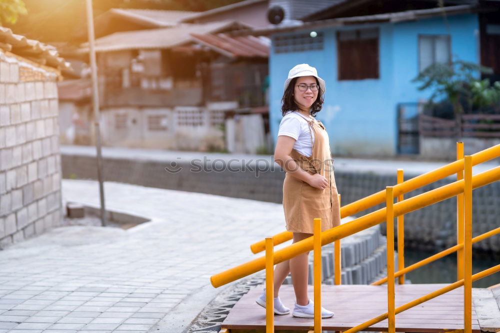 Similar – Image, Stock Photo Pretty stylish woman putting on cap
