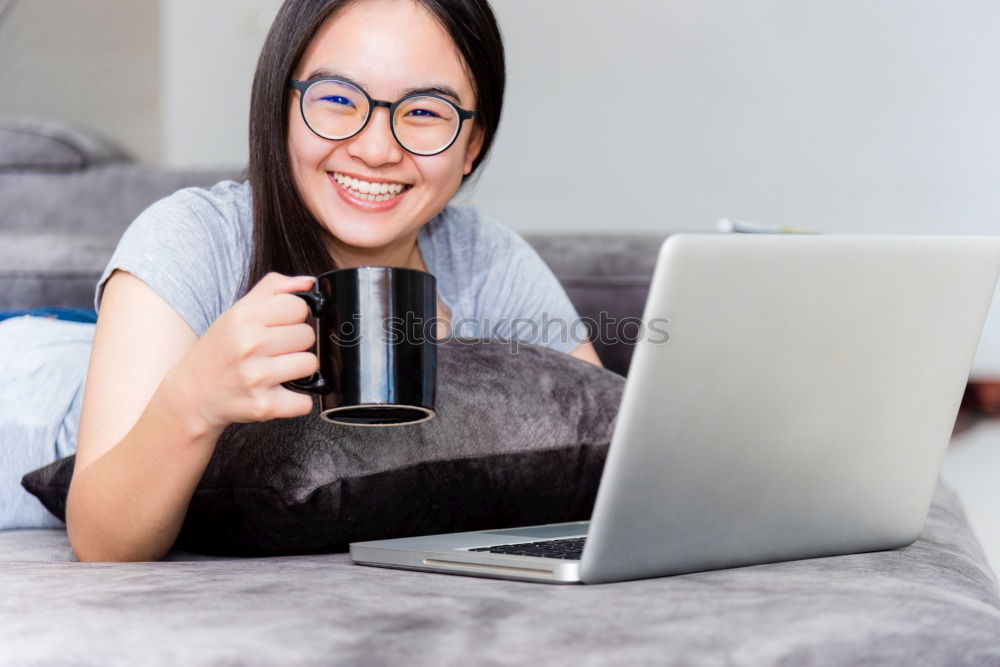 Similar – Image, Stock Photo brunette woman is using her computer while having a coffee