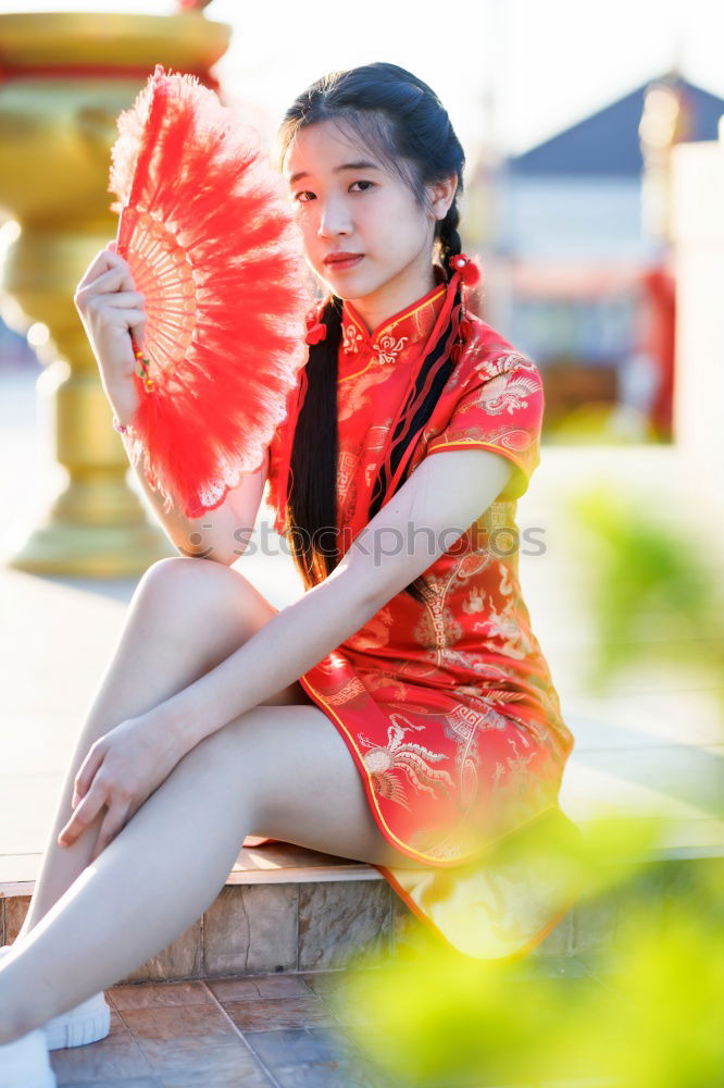 Similar – Pretty Asian woman sitting at pond