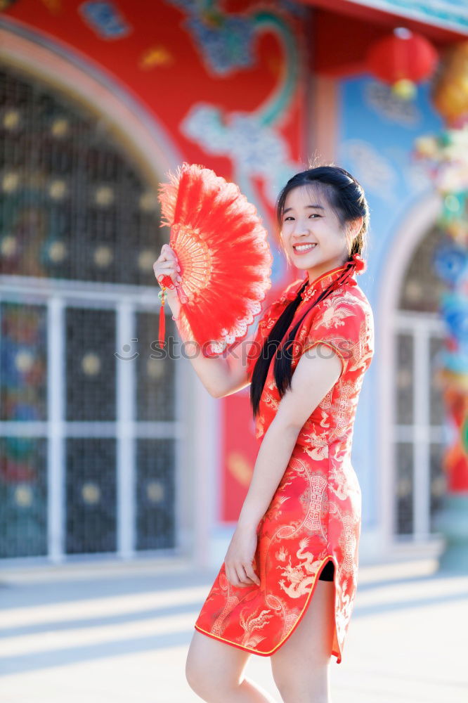 Similar – Woman fanning herself.