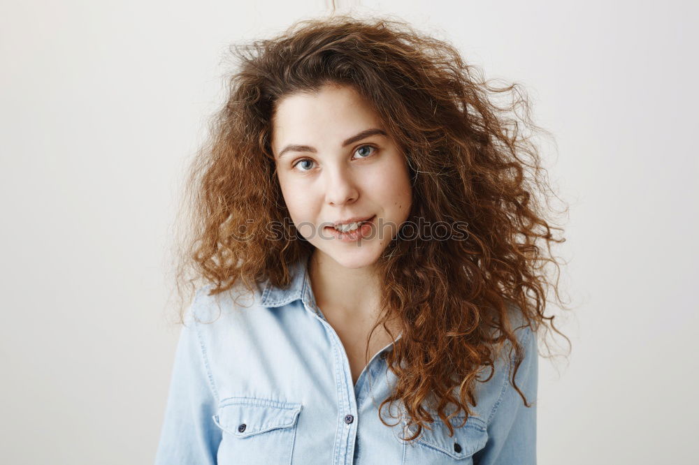 Similar – young beautiful redhead woman with curls and freckles smiles at camera