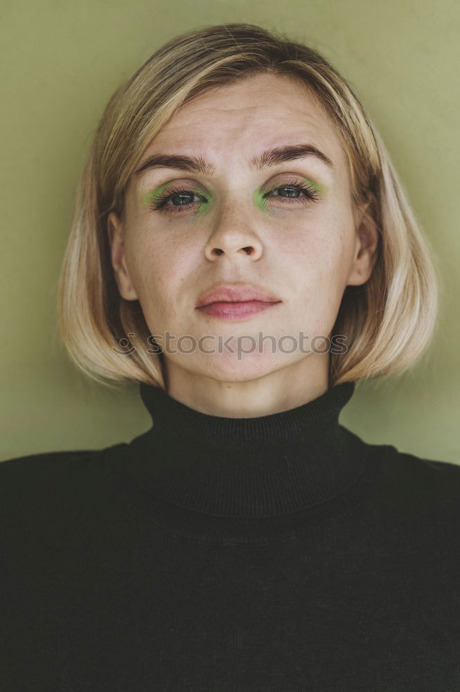 Similar – Elegant woman standing against dark background