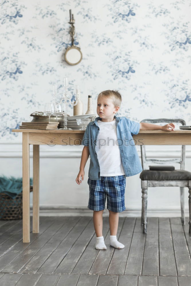 Similar – Boy in cook hat in kitchen