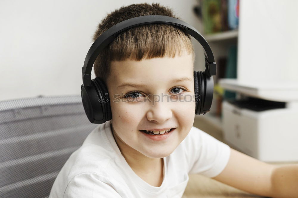 Similar – little boy with headphones