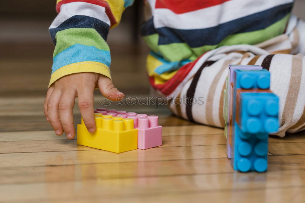 Similar – Image, Stock Photo Happy baby playing with toy blocks.