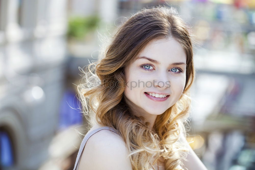 Similar – Young woman smiling in urban background.