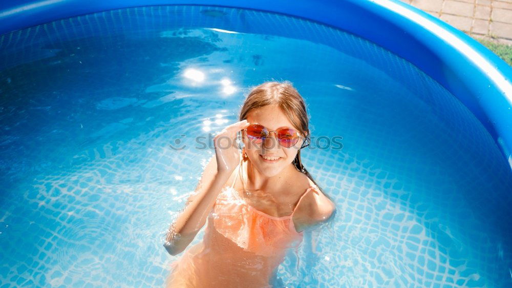 Similar – Image, Stock Photo Woman legs in a swimming pool with lifesaver