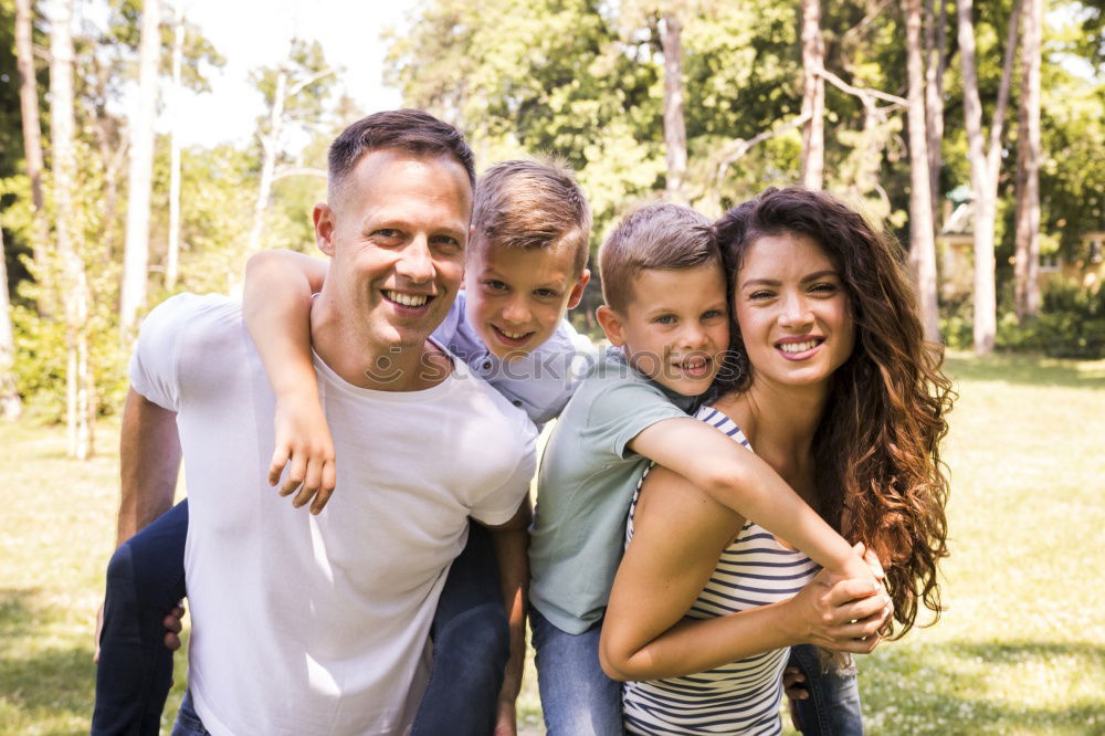 Similar – Happy family in a urban park playing with tablet computer