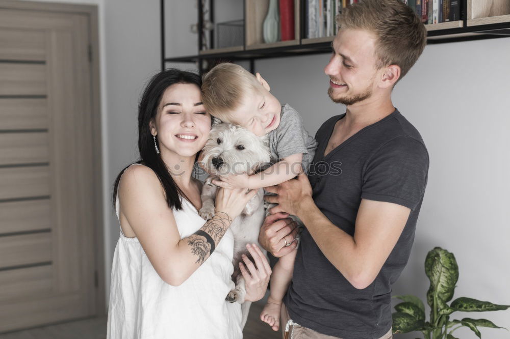 Similar – Couple relaxed at home in bed with their little daughter and the dog