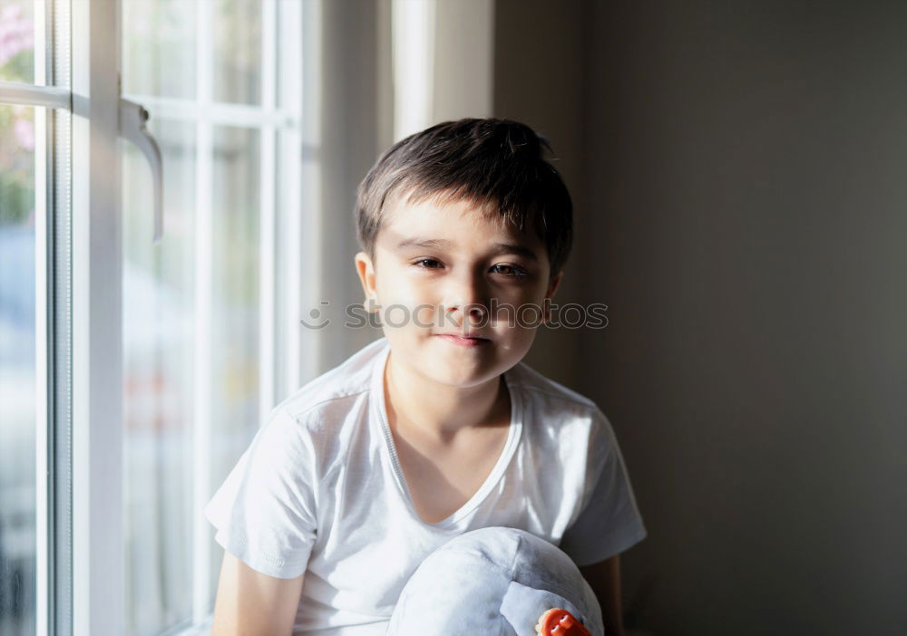 Similar – Image, Stock Photo Portrait of a young student leaning on wall while looking camera