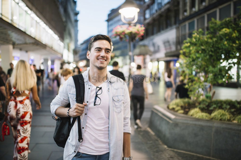 Traveler using smartphone on city