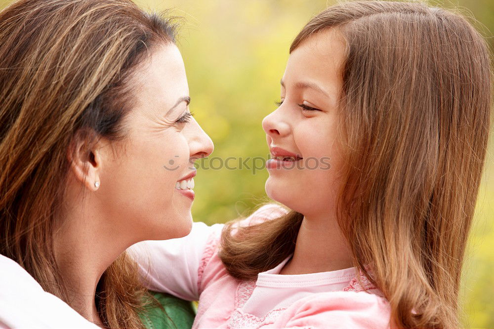 Similar – Image, Stock Photo Mother and son seated on a park