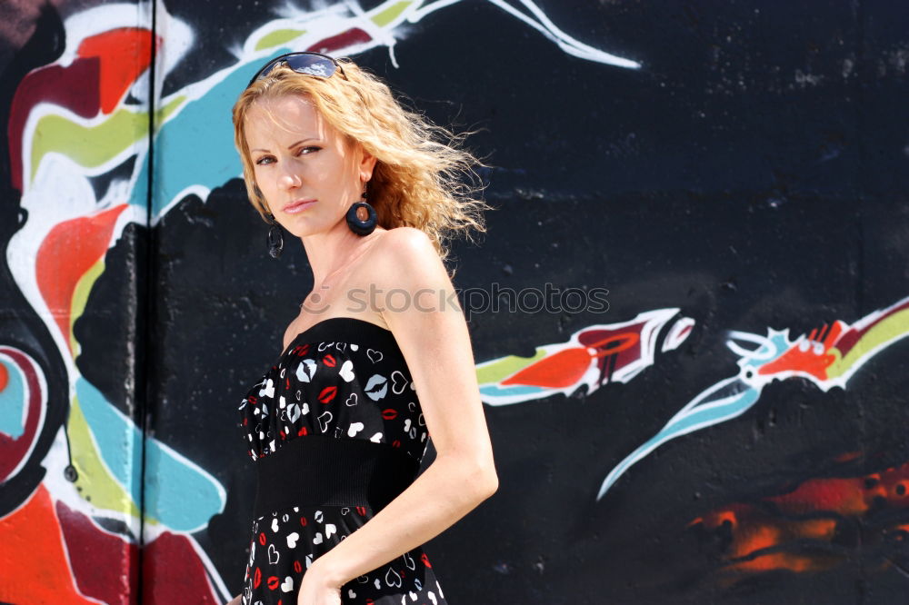 Image, Stock Photo Young woman standing in front of graffiti