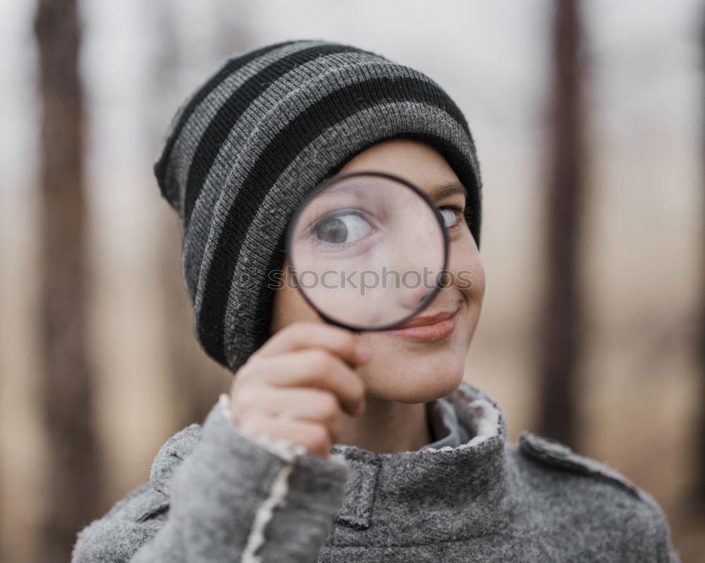 Similar – Image, Stock Photo young funny woman investigating with a magnifying glass