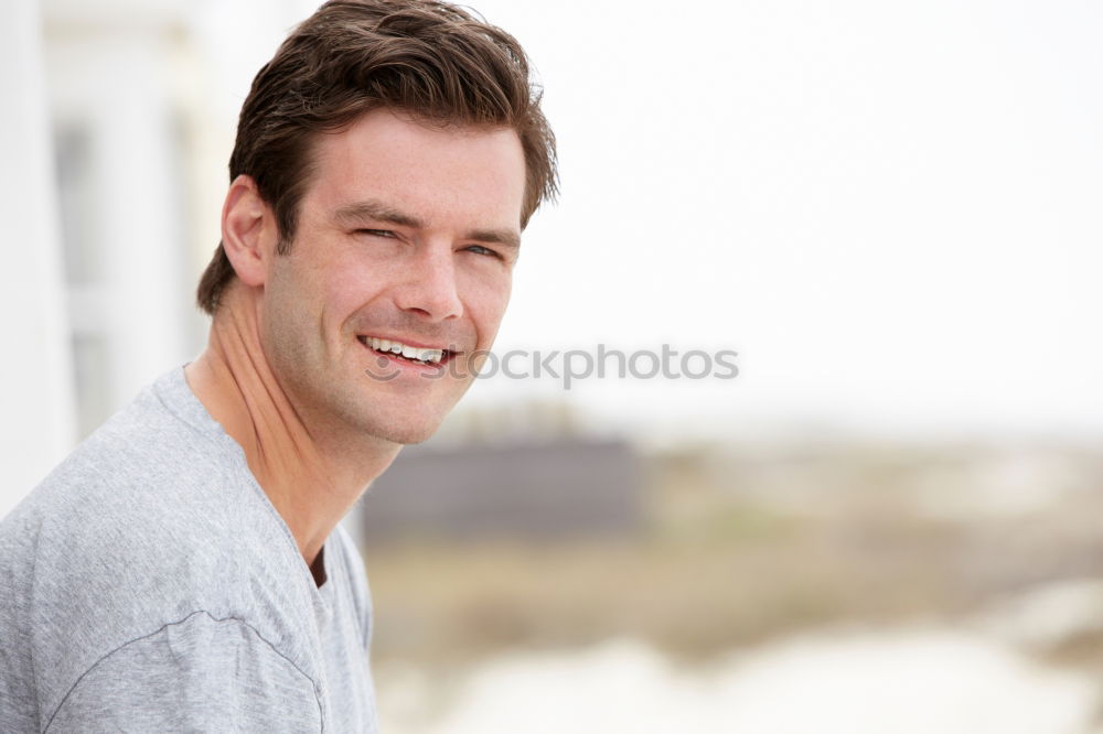 Similar – Young man smiling in urban background