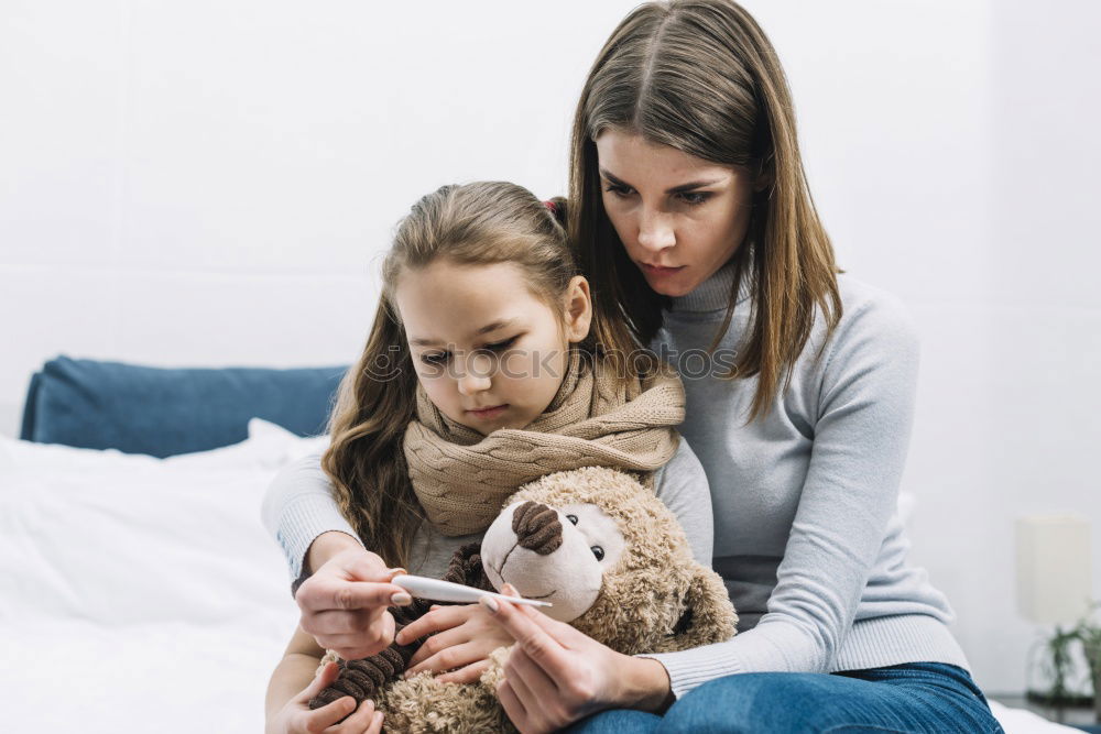 Similar – Image, Stock Photo Girl and boy reading a book sitting on the bed