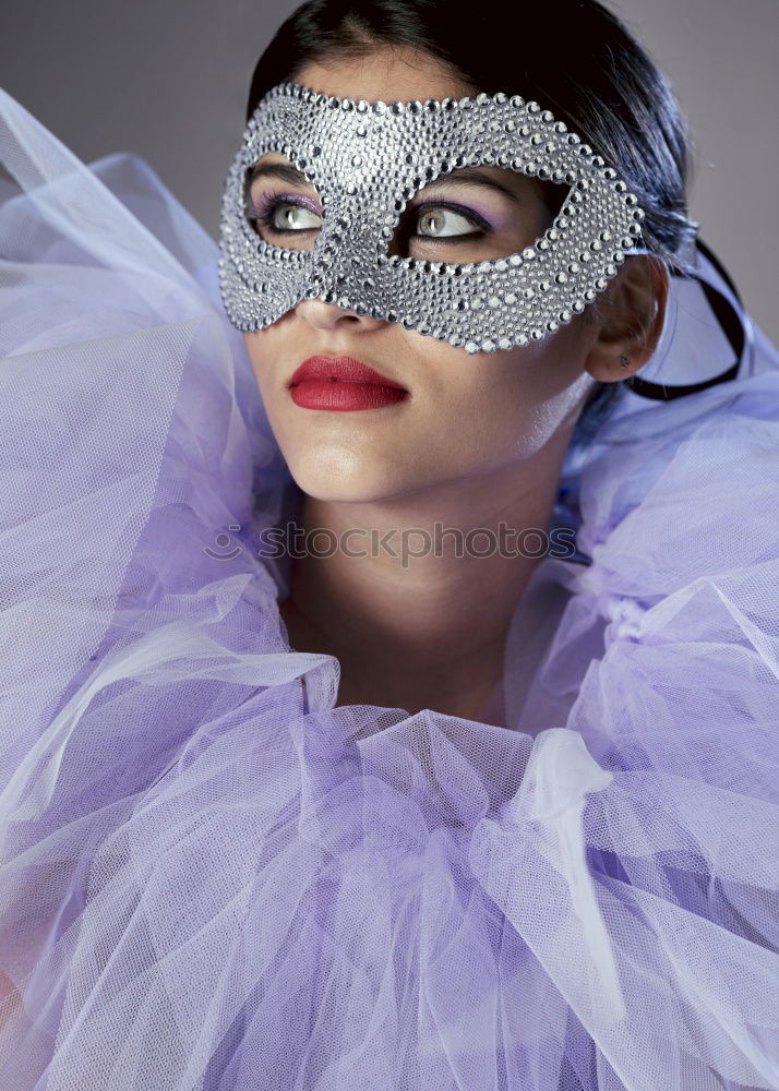 Similar – half face of a woman surrounded by silver garlands