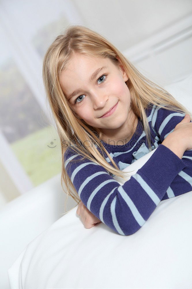 Similar – cute happy child girl relaxing at home on the bed