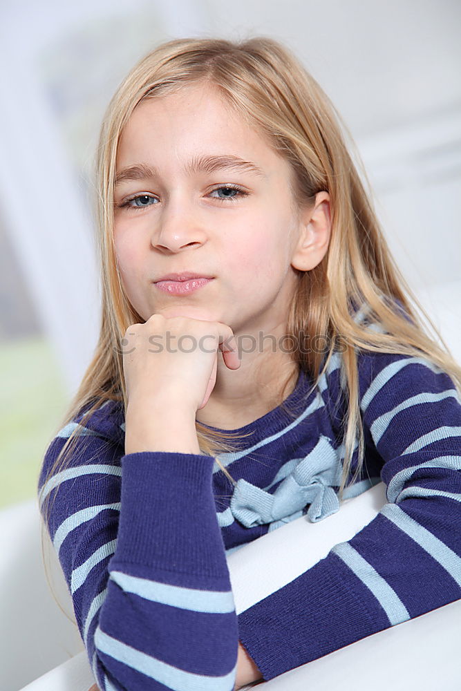 Similar – Cute schoolgirl posing in a classroom