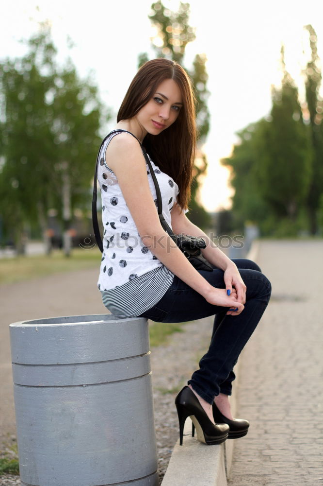 Similar – A young woman sitting on a garden bench