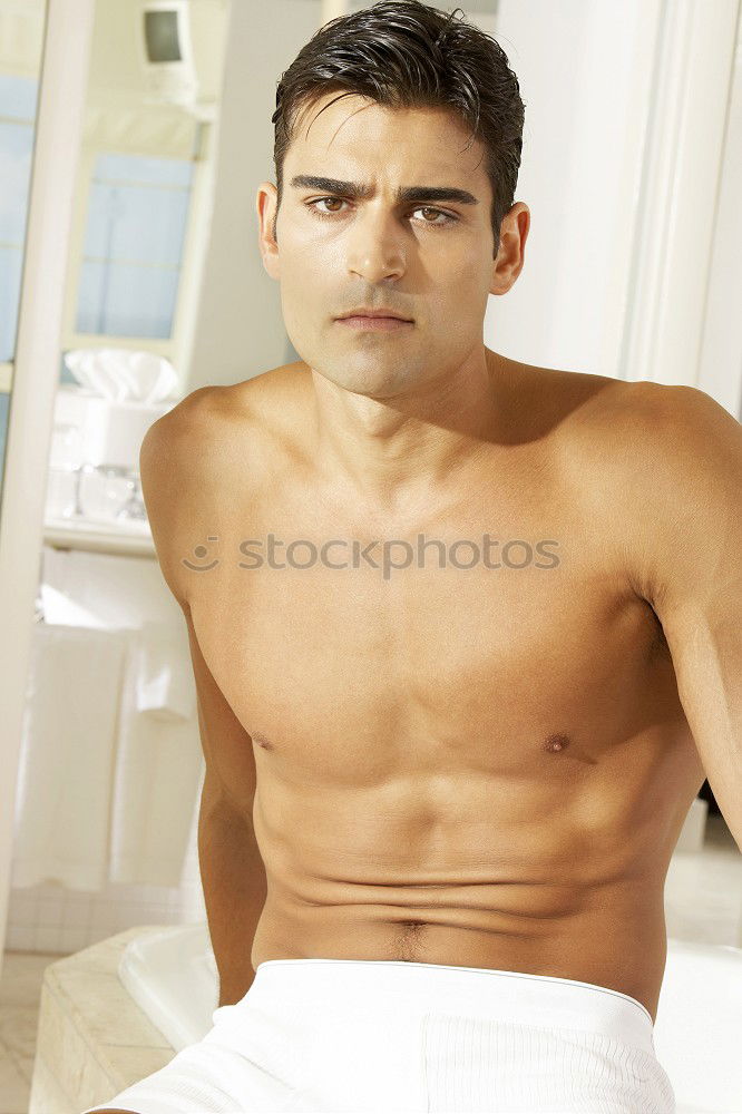 Similar – Young sexy pensive man sitting on bed