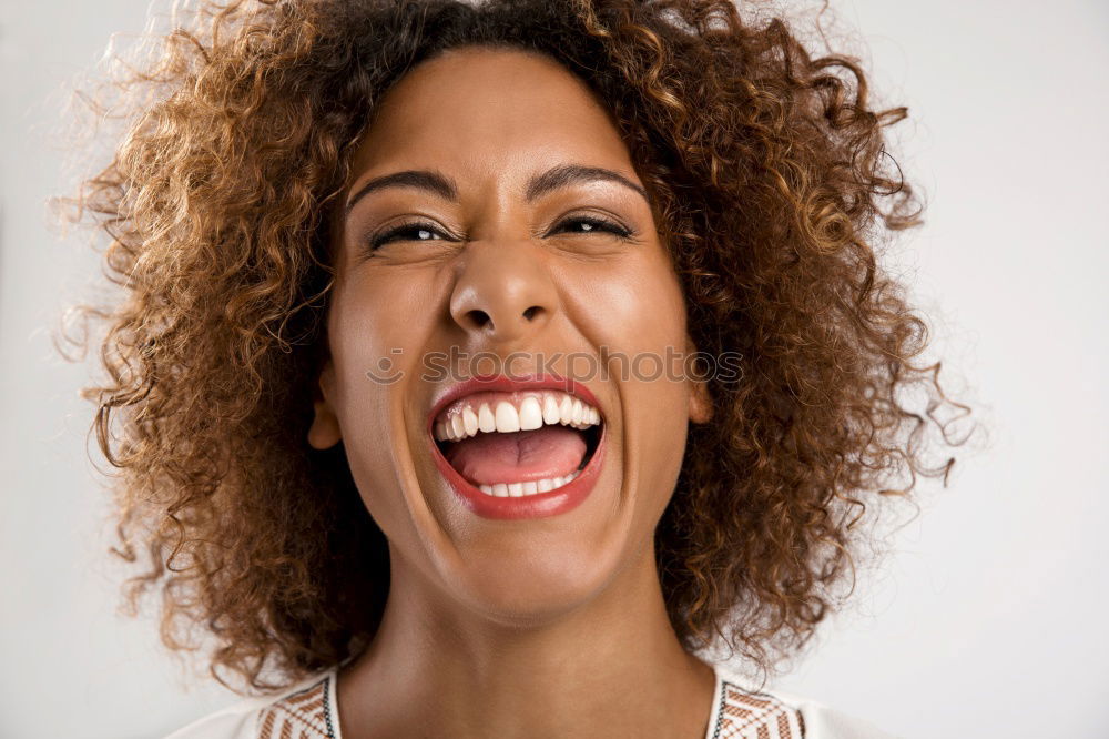 Portrait of a young black woman smiling with braces